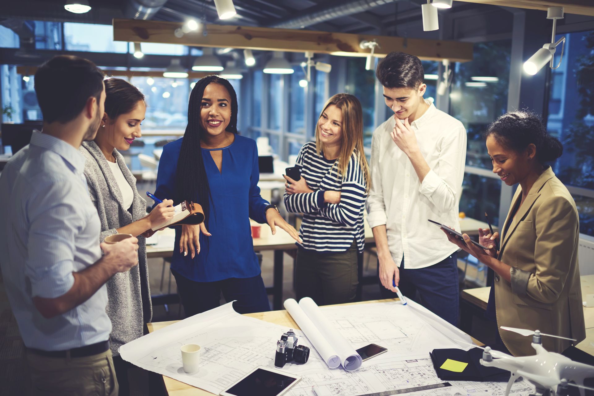 A group of people reviewing a business plan together