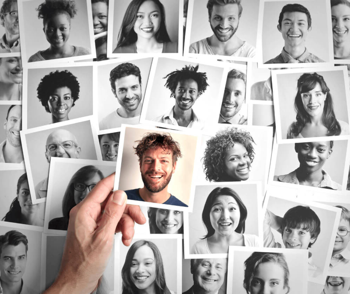 Black and white headshots with one colored headshot in the middle