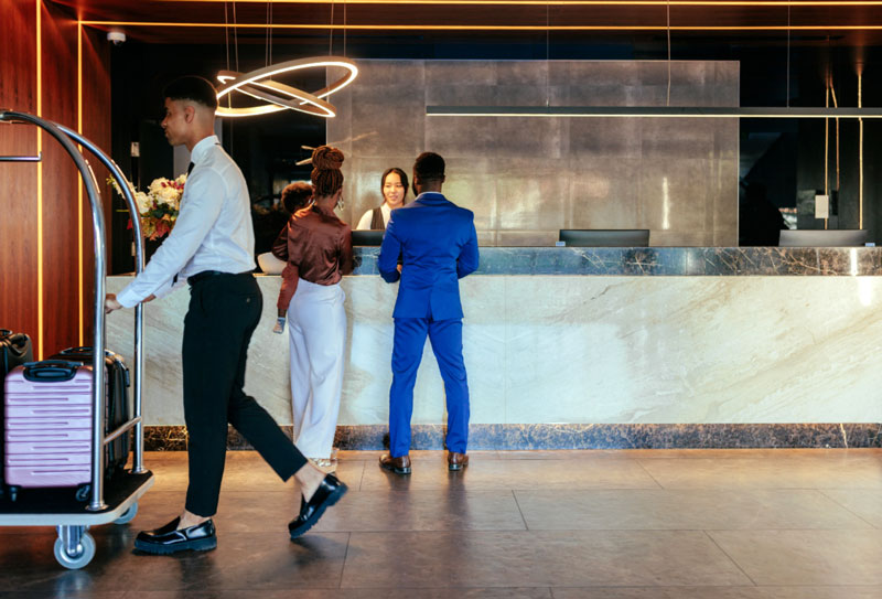 People in the reception area of a hotel