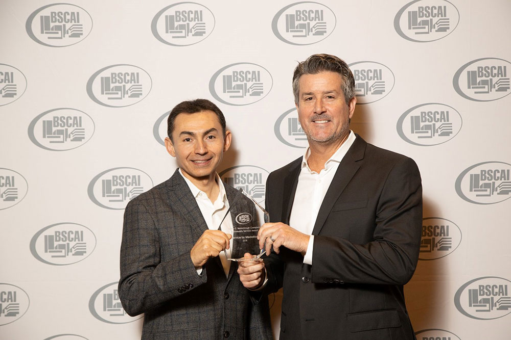 Service by Medallion leadership team accepting award from BSCAI