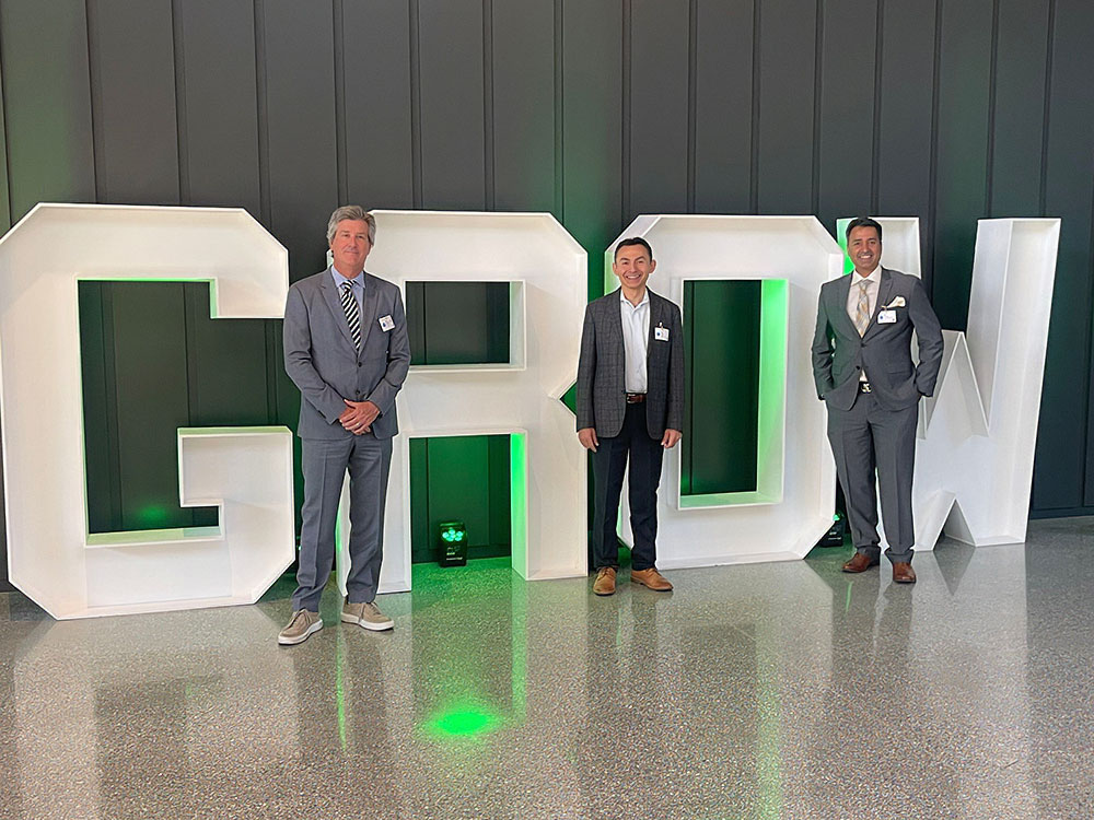 Service by Medallion leadership team in front of GROW marquee letter sign