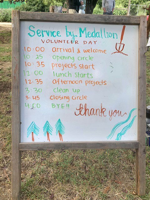 White board describing the activities for Service by Medallion's volunteer day