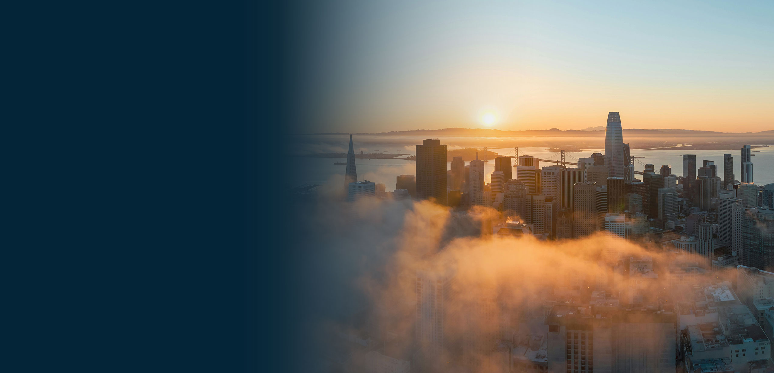 Expansive sunset view of the San Francisco skyline