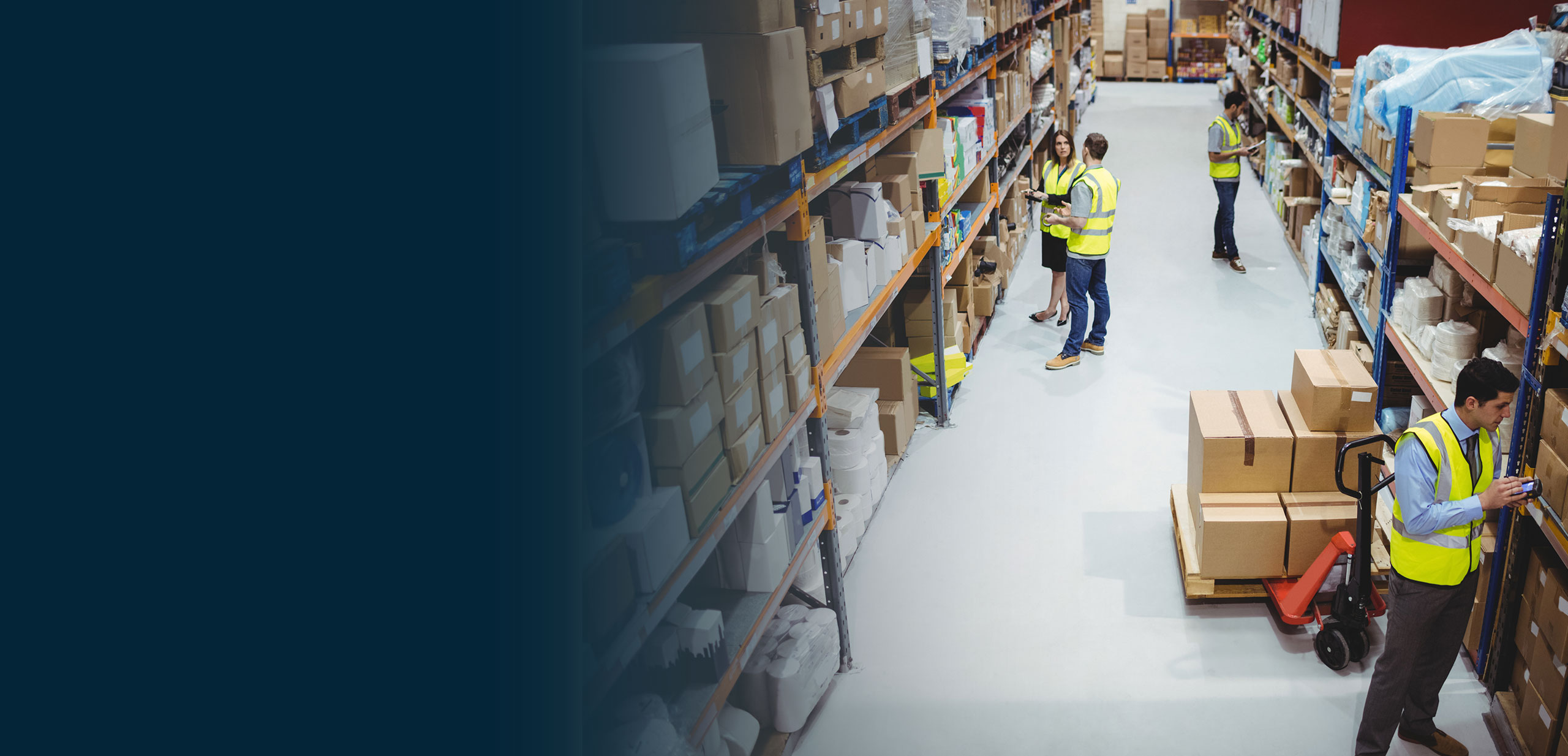People inside of a warehouse managing general warehouse operations